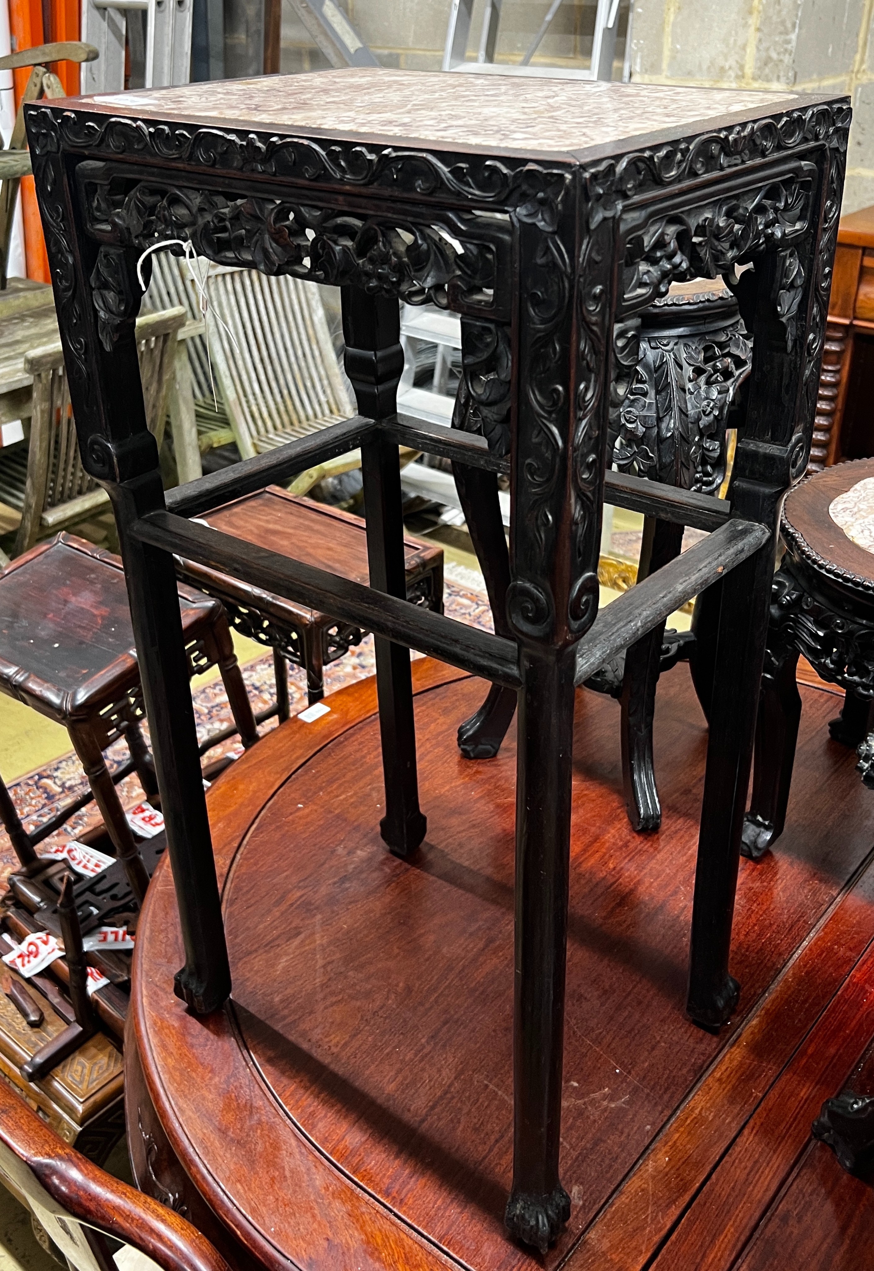 A Chinese marble top carved hongmu vase stand, width 42cm, depth 32cm, height 80cm